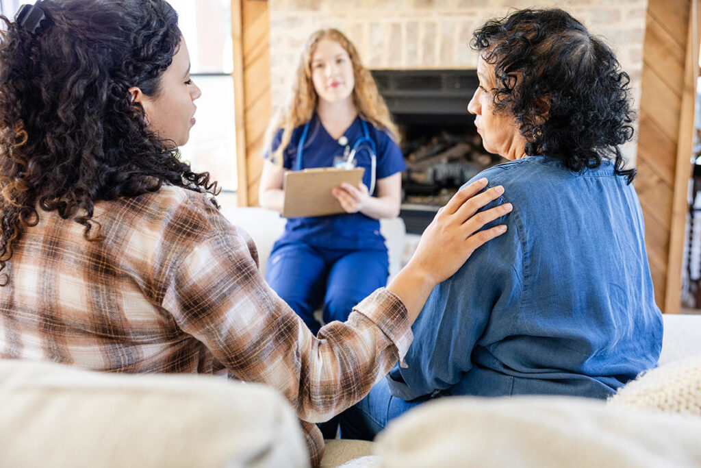 Family speaking with a caretaker