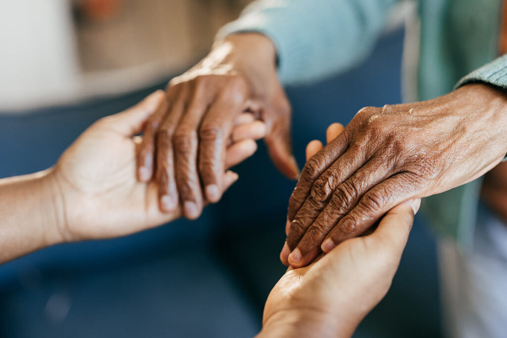 Hands holding each other