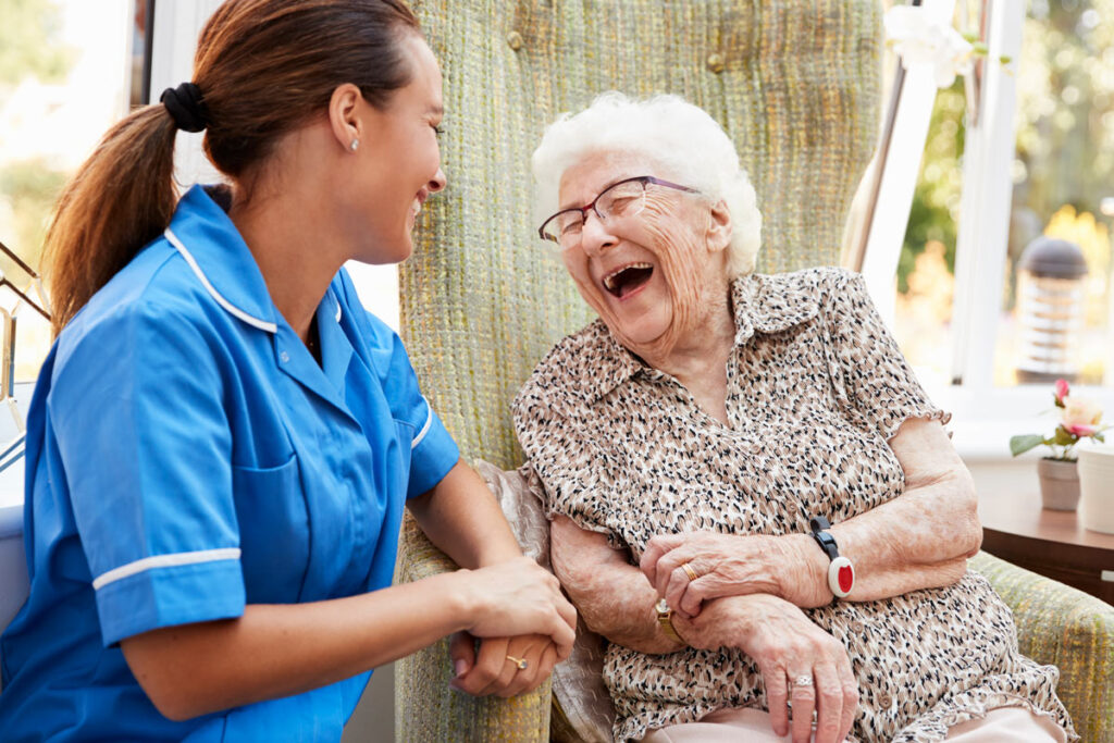 Caretaker laughing with woman